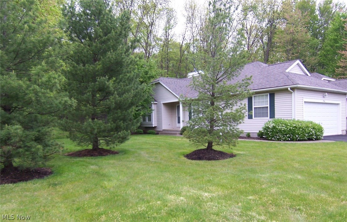You won't want to miss this fabulous condo located on a cul-de-sac in popular Woodbury! You will never feel as if you live in a condo because there is so much green space! The beautiful side yard allows much space for privacy or playing outdoor games! The Square footage on the Auditor Website is incorrect. The main level sq footage is 1354, plus an additional 120 sq ft w/the screened porch, and there is approx 420 sq ft finished on the lower level. This condo offers a foyer entry with wood flooring, a vaulted great room w/a window seat & a gas fireplace, a bayed dining area with wood floors, and a fully applianced kitchen w/a breakfast bar, recessed lighting, wood floors and a pantry. A door from the dining area opens to a screened porch, and off the screened porch is a deck to the back yard. There are two large bedrooms - the master bedroom is 20x12 - easily accommodating king-sized furniture, and includes a sitting area perfect for a small office. The attached bath has a double sink