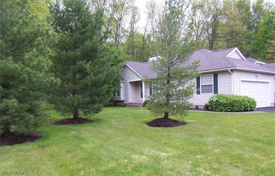 You won't want to miss this fabulous condo located on a cul-de-sac in popular Woodbury! You will never feel as if you live in a condo because there is so much green space! The beautiful side yard allows much space for privacy or playing outdoor games! The Square footage on the Auditor Website is incorrect. The main level sq footage is 1354, plus an additional 120 sq ft w/the screened porch, and there is approx 420 sq ft finished on the lower level. This condo offers a foyer entry with wood flooring, a vaulted great room w/a window seat & a gas fireplace, a bayed dining area with wood floors, and a fully applianced kitchen w/a breakfast bar, recessed lighting, wood floors and a pantry. A door from the dining area opens to a screened porch, and off the screened porch is a deck to the back yard. There are two large bedrooms - the master bedroom is 20x12 - easily accommodating king-sized furniture, and includes a sitting area perfect for a small office. The attached bath has a double sink