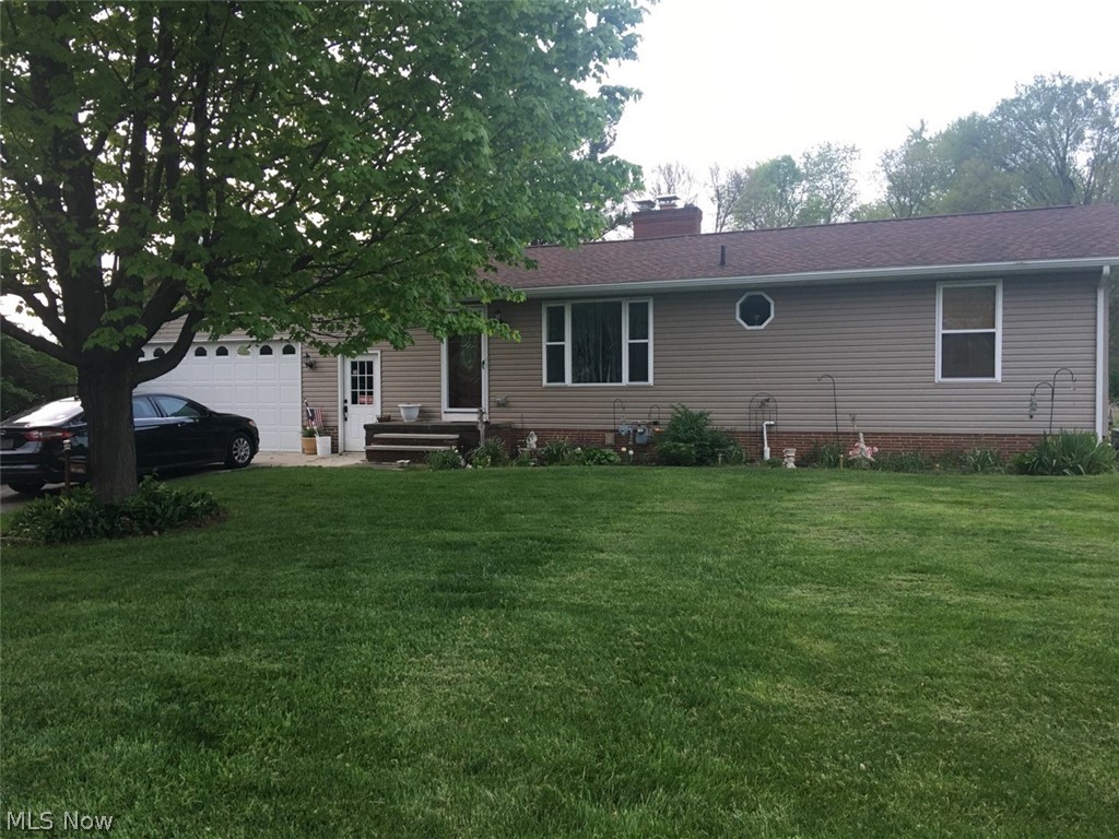 Updated ranch on over 3/4 of an acre. Beautiful kitchen with loads of counter tops and cabinets! 200 amp electric. 4 car attached garage, heated and cooled, with an additional detached 14x22 garage. Beautiful backyard. Shed, finished lower level.