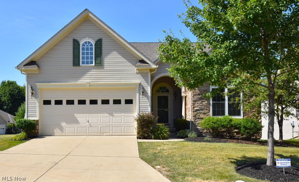 Welcome to this beautiful ranch style home in the Villas of Kensington neighborhood in Twinsburg. Ranch style, open floor plan, with a full finished walk out basement displaying spectacular views overlooking the valley. All three bedrooms are located on the main floor with two more bonus rooms in the basement that are perfect for an extra bedroom or workout/play room. The main floor features engineered hardwood flooring throughout, large windows with custom blinds, vaulted ceilings and a large eat-in kitchen with a stunning, stone floor to ceiling fireplace. Beautiful sun-room offers a place to relax with a cup of coffee or or can even be used as an extra office space. The deck comes with an awning and provides an optimal setting for entertaining. The large master bedroom features a trayed ceiling with accent lighting and a bathroom ensuite with tub,shower and double sinks. Laundry is conveniently located on the first floor. The full finished walk out basement is a fantastic recre