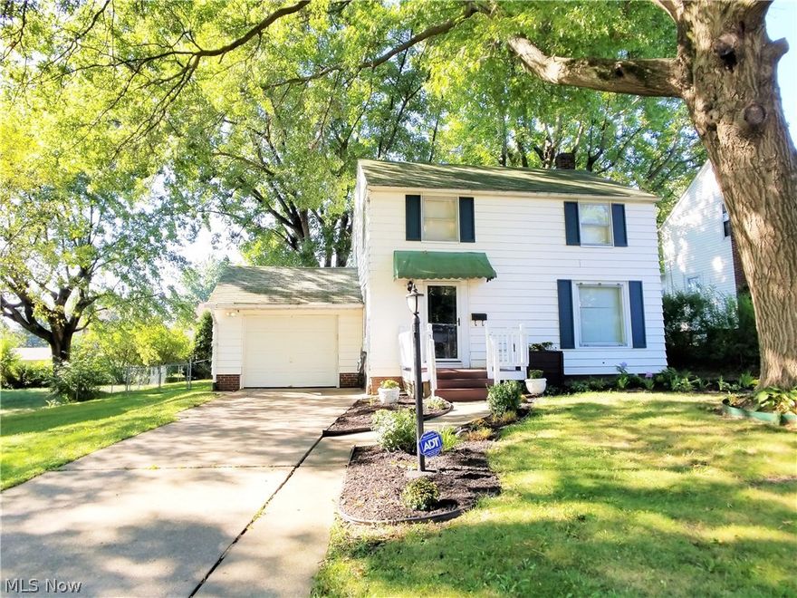 Welcome Home!!!  This adorable 2 story home in the heart of Colonial Heights is charming in every way.  From the beautiful curb appeal, to the neutral home design and open concept, you will fall in love!!  The Florida room and outdoor entertaining areas will make you the envy of the neighborhood! Hardwood floors in the main living area and all the bedrooms and a tiled kitchen sets this home apart from the rest!! Have peace of mind with saving energy with the NEST thermostat. The home is also wired for an ADT security system.  This home also qualifies for the City of Canton Down Payment and Closing Cost Assistance program...ask me how to get pre-qualified.