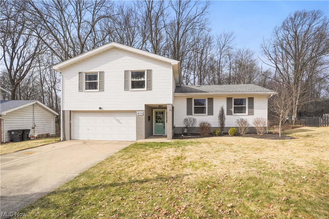 This lovingly cared for home is located adjacent to Sand Run Metro Park. Convenient to schools, shopping and recreation. Split level home offers 1884 sq ft of living space. Entering the home, an expanded foyer with built in coat and shoe drop greet you into this renovated home. Up 5 steps to main level with living room and dining room with sliding door to expanded exterior deck. Fresh paint, beamed ceilings and original hardwood flooring. The kitchen was refreshed with paint, ceramic tile flooring, tile backsplash and stainless appliances. Up 5 more steps to 4 generous sized bedrooms and two full bathrooms. All bedrooms with hardwood flooring, fresh paint and lighting. The bathrooms have been rejuvenated with newer flooring, vanities, tub and shower stall. The lower level features a family room with half bathroom and exterior access. A built-in desk and bookshelves make storage and schoolwork clutter free. The basement contains the laundry and ample storage areas. Vinyl siding (2017) Roof (2015) A/C (2018) Electrical Panel (2019) Hot water heater (2015) and Plumbing (2015) are just some of the endless improvements to the home. Wonderful views of the park greet you from your back decks. Attached 2 car garage and gardening storage shed complete this home. Call to schedule your showing today.