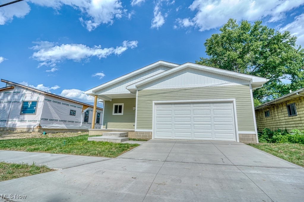 The home of your dreams is waiting for you in the Magic City! This 3 bedroom, 2 bathroom home, complete with 15-year tax abatement and other available incentives, is located minutes from Downtown Barberton, Portage Lakes, and Akron. Amenities include 2 playgrounds and parks within walking distance, Ohio and Erie Canal Towpath trailheads within a mile, and a school district that offers great teachers, ample extracurricular activities, and public preschool, making it one of the area’s best.
The house itself is constructed above and beyond industry standards and codes, using 2x6 framing, resulting in exceptional energy efficiency and structural integrity. Stylish flooring with a commercial-grade finish is throughout the house, and holds up to pets, kids, and those “oops” moments. All living spaces are complete with ceiling fans and 9’-0” ceilings, and the garage is sized to house a full size pickup truck, including an oversized 8’ door, so the kayaks or ladder rack will never be an issue.
The spacious kitchen features painted solid plywood cabinets, stainless appliances, and quartz countertops ready for decades of easy cleanup after home cooked meals and warmed up leftovers alike. Large front and rear porches are private enough for some quiet time, yet still offer an excellent vantage point to watch the friendly neighborhood go by. Doors are a full 36” for easy navigation with a laundry basket, a walker, or kids in tow. A high efficiency tankless water heater delivers on-demand hot water to the spacious, spa-like master bathroom, making that relaxing bath in the stand-alone tub or hot shower after a long day just a little bit better, knowing you’ll be saving money on every gallon.
All of these features and more are thoughtfully designed into the house with your comfort and outstanding performance as top priorities. Schedule a tour today to see the difference!