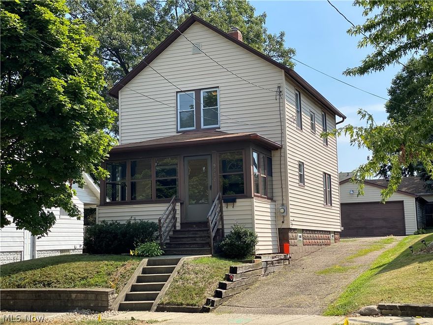 Great starter home for a first time buyer or a move-in ready investment property!  This cozy early 20th century home has an enclosed front porch, a welcoming entrance to the living room extends to the dining room with french doors out to the back deck.  Kitchen is off of the dining room and also leads down to the basement.  Upstairs you will find the two bedrooms, one with a very large walk-in closet, built in cabinets in the hallway next to the bathroom.  In the backyard you will find a large two and a half car garage with electricity and it's own electrical panel.  This home is minutes from downtown Akron, and close to both I-77 and I-76.