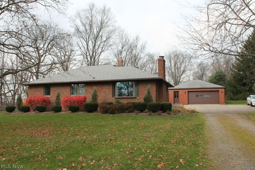 Beautifully maintained ranch. All brick. 3 bedrooms w/hardwood floors and two full baths on over an acre lot. Oversized garage 28x 40 and converted outbuilding, 14 x 32. Great setting. Priced to sell!