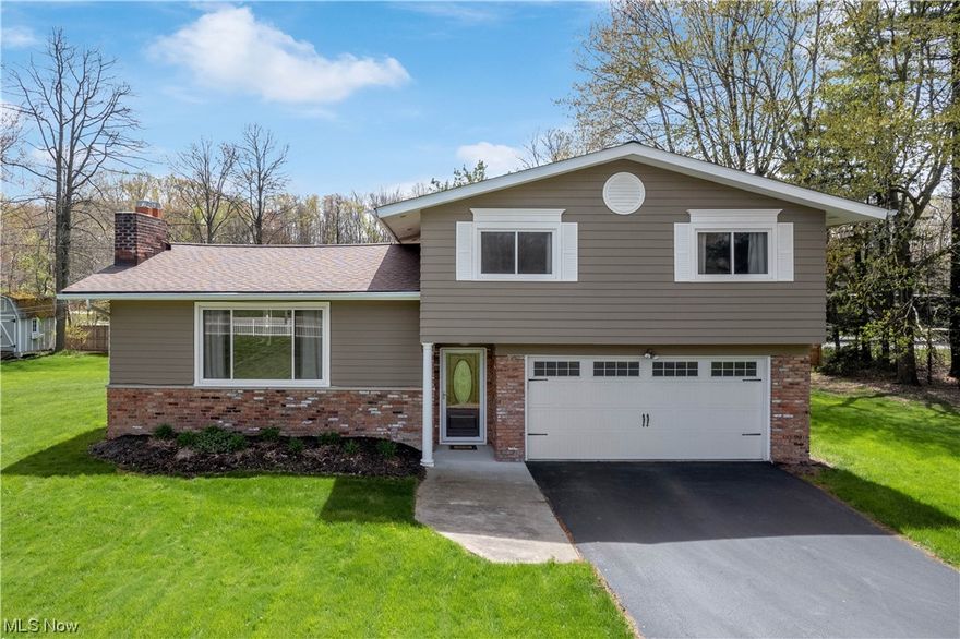 Welcome to this amazing, pristine open layout, split-level home in Bainbridge! As you enter the foyer and proceed to the oversized family room, you will be greeted by the beautiful wood floors throughout and the upgraded fireplace including gas logs w/remote control, oil rubbed bronze doors and new wood mantle and shelving. The vaulted ceilings lead you to the modern kitchen w/quartz countertops, stainless steel appliances, backsplash, pendant lighting, shake white cabinets, recessed lighting and a large island w/a breakfast bar. There’s a spacious eat-in kitchen w/access to the outdoor patio. The large owner’s suite has a walk- in closet w/an organizational system, wood floors and a fully updated bathroom w/dual sinks, ceramic tile floors, tiled shower and a glam vanity. The two additional bedrooms are spacious w/wood floors and a fully updated hall bathroom w/ceramic tile floors and shower on the 2nd level as well. Large foyer with guest bath. The lower level is great for entertainin