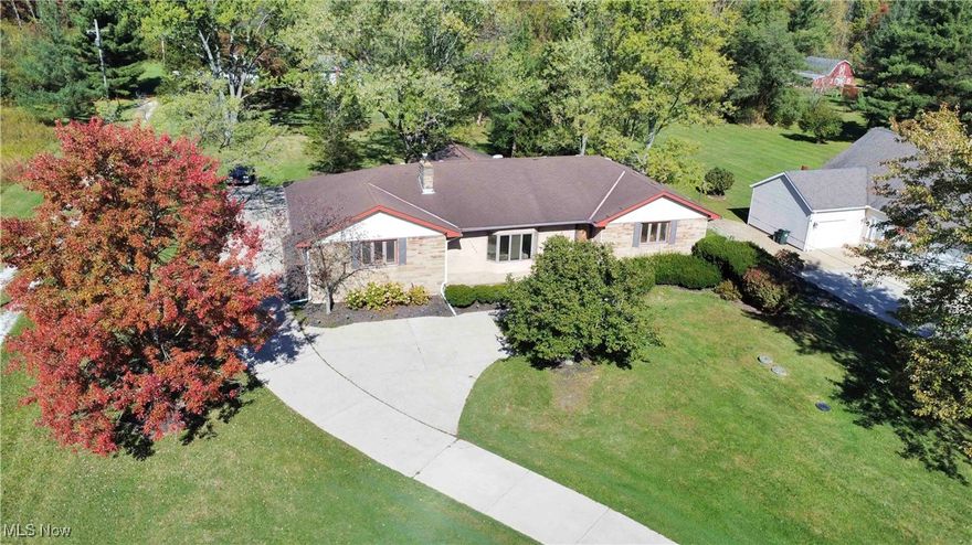 One of a Kind! First Time Ever on Market! Welcome to 11438 Drake Rd, a rare gem in North Royalton! This sprawling 3-bedroom, 2 full bath ranch offers nearly 2,500 square feet of beautifully maintained living space on a serene 0.62-acre lot. Owned and loved by just one meticulous owner, this home is filled with warmth, character, and charm that modern homes simply can’t replicate. Set back from the road, the long, winding driveway leads you to a stately stone and brick facade with undeniable curb appeal and a cozy front patio – perfect for morning coffee or evening sunsets. Step inside to discover a sunken living room featuring a stunning stone gas fireplace, ornamental rail accents, and an open, inviting layout that flows seamlessly into the dining area and kitchen. The kitchen boasts solid wood cabinetry and a sink overlooking the peaceful backyard – a touch of nostalgia and function combined. The vaulted family room is a true showstopper – ideal for gatherings with its beamed ceiling, bay window, and sliding doors to a large deck overlooking the lush, park-like backyard. Down the hall, you’ll find two spacious bedrooms with hardwood floors, plus a generous primary suite complete with crown molding, dual closets, hardwood floors, and a private ensuite bath with walk-in shower. Need more space? Head downstairs to the partially finished basement, offering a large rec room, office space, laundry room, mechanical room and ample storage space. The attached 32x22 garage is clean, finished, and perfect for vehicles, hobbies, or a workshop. The back yard is a peaceful, private retreat and perfect for entertaining, relaxing, or letting kids and pets run free. Located just minutes from Strongsville’s shopping, dining, I-71, and surrounded by some of Northeast Ohio’s best Metroparks – this home offers the perfect blend of nature, convenience, and timeless charm. Don't miss your chance to own this truly special home. Schedule your private tour today!