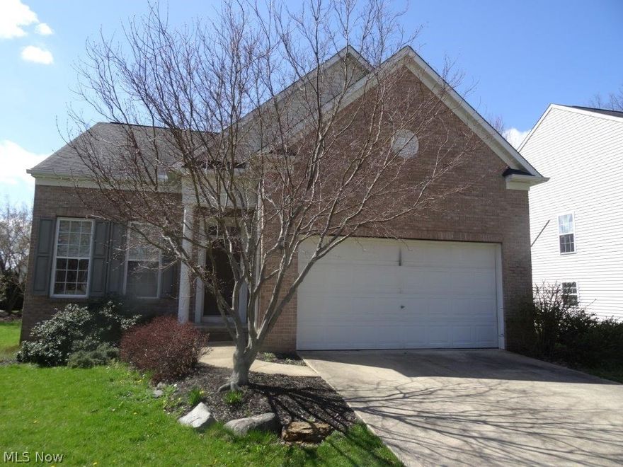 Gorgeous newer Stow home, completely redone inside - new carpet and painted throughout, super clean and move-in ready!  Rare first floor master suite with shower/tub and walk-in closet!  Open 2 story great room w/fireplace, bright and open kitchen includes all white appliances.  Breakfast area/dinette opens to a back deck and nice yard.  Formal dining room and half bath complete the main floor.  Upstairs has 2 ample bedrooms and full bath, basement is partially finished and has a full bath!