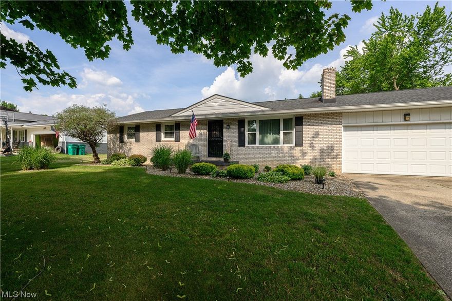Welcome to this charming all brick ranch, a move-in-ready gem boasting three bedrooms and two full baths. Upon entering, notice the updated wood laminate running through the main floor. The family room is warm & cozy with the woodburning fireplace and gray brick front being the centerpiece. The dinette is enhanced with wainscoting, adding a classic and refined touch. From the dining area, you have convenient access to the back deck, offering a great outdoor entertaining & relaxation space. The dinette is attached to the well-appointed kitchen, making serving meals a breeze. The kitchen is both functional and visually appealing, featuring laminate counters that offer ample workspace and easy-to-maintain vinyl flooring. The tile backsplash adds a stylish touch to the space while the stainless steel appliances provide a modern and sleek look. Down the hall, find three comfortably sized bedrooms. The master suite is lovely, featuring its own remodeled full bath for added convenience and pr