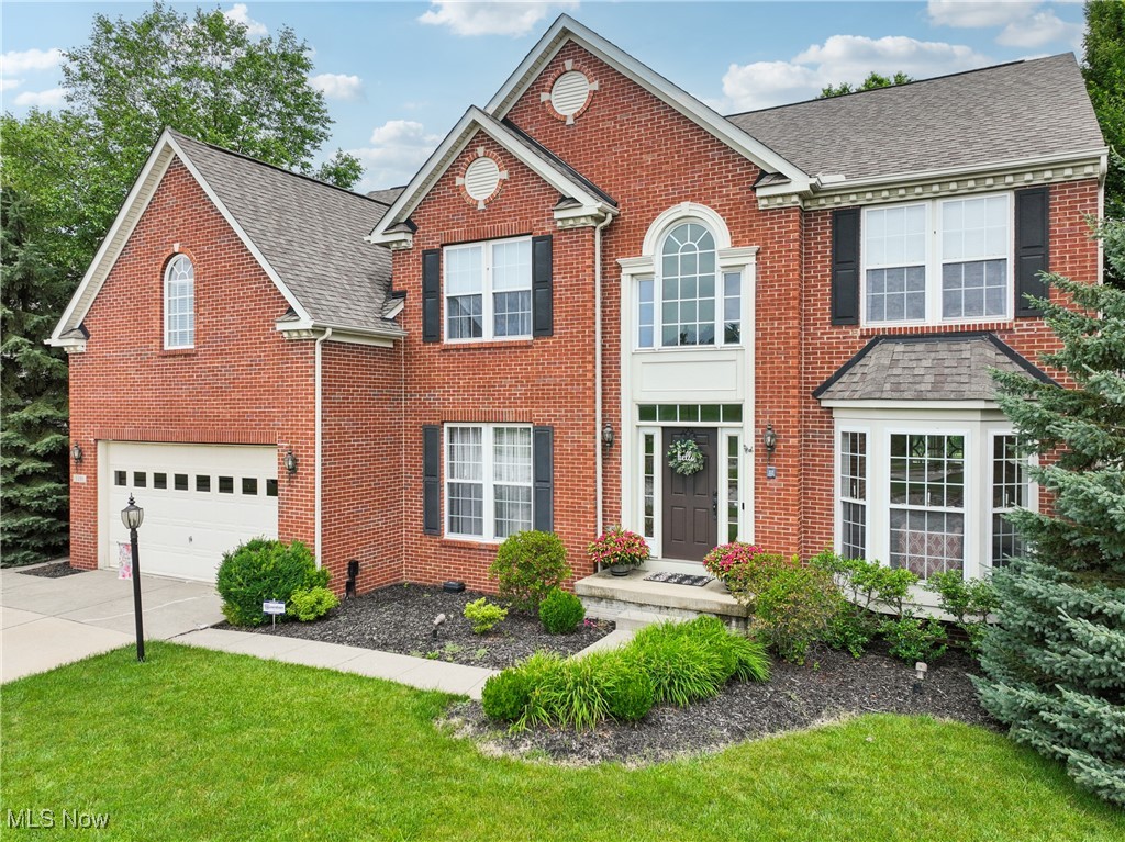 Immaculate and Beautifully Decorated Colonial, Where Sophistication Meets Comfort. Freshly painted throughout and featuring new carpeting on the main floor and primary bedroom, this residence exudes a like-new feel. The first floor boasts nine-foot ceilings and several bay windows, flooding the space with abundant natural light and creating an airy, welcoming atmosphere. The gourmet eat-in kitchen is a true showstopper, featuring a massive island with granite countertops, breakfast bar area, stainless steel appliances, ceramic tiled floors, and an impressive 8x5 pantry. Sliders lead to low-maintenance decking, a charming stone patio, and a meticulously manicured lawn perfect for entertaining or quiet relaxation. The heart of the home is the breathtaking two-story great room with soaring 18-foot ceilings and a stunning floor-to-ceiling stone fireplace, viewed from a dramatic catwalk above. A large formal dining room with a tray ceiling and a spacious living room with two bay windows provide elegant spaces for gatherings, while a dedicated first-floor office offers privacy for work or study. The two-story foyer, office, hallway, and half bath are finished with beautiful hardwood floors, complemented by the convenience of a main-level laundry room. Upstairs, discover four generously sized bedrooms, including a luxurious primary suite with its own high tray ceiling, spa-like en suite bath with walk-in shower, soaking tub, his-and-her vanities, and separate walk-in closets. The expansive finished basement adds approximately 1,966 sq. feet of additional living space, complete with a massive rec room, a mirrored exercise room, a media room currently used as a second office, and a cozy stone bar area with a beverage fridge-the perfect retreat for entertaining. This was the model home for the development and is loaded with upgrades throughout. This move-in-ready home truly has it all and will not last long! Make this spacious, open and airy property yours today.