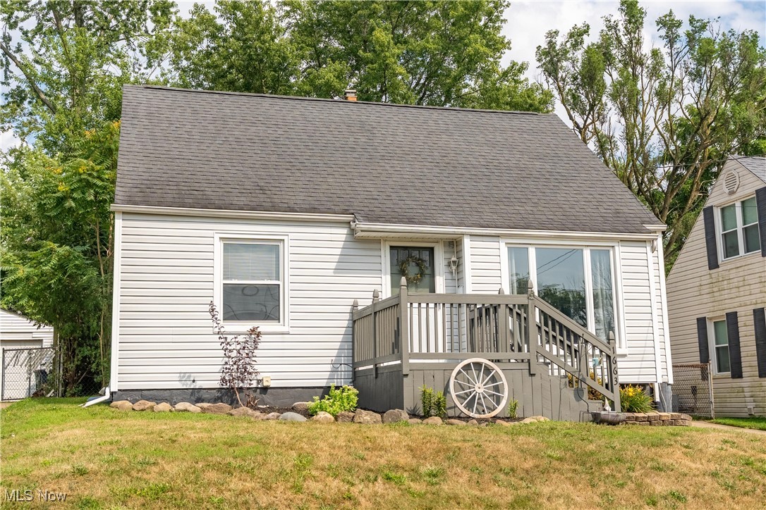This charming bungalow offers over 1,300 sq ft of bright, inviting living space and is a must-see! Step onto the welcoming front porch and into a modern home filled with warmth and natural light. Inside, you'll love the calming color palette, wood floors, and spacious layout. The sunny great room features a large picture window and a wide, open entryway, creating flow throughout the main level. Just off the great room are two bedrooms and a full bathroom with a tub/shower combo. The surprisingly spacious kitchen is a standout, complete with white cabinetry, a tile backsplash, stainless steel sink, and a cozy dining area. Sliding glass doors lead to a large patio, perfect for indoor/outdoor entertaining. Enjoy time with family and friends in the fenced backyard featuring a patio and a fire pit, ideal for evening gatherings. Upstairs, you’ll find a third bedroom with a large closet and a charming mini loft area. The partially finished basement includes a versatile rec room with built-in storage, a laundry area with a utility sink, and a workbench for projects or hobbies. A detached 1-car garage completes the package. Conveniently located near schools, shopping, and highway access. Don’t miss your chance to call this home! Schedule your private showing today.