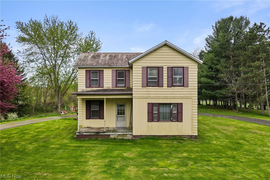 Welcome to a unique opportunity to own over 5.16 acres of property, offering endless potential. Located in the Tuslaw School District, the home features spacious rooms, tall ceilings throughout the first floor, a first-floor laundry room, and a full basement. Behind the house is an oversized detached garage/pole barn and a picturesque creek that runs through the wooded rear of the property. The following improvements were completed in recent years: replaced steel roof over kitchen (2016), replaced hot water tank (2022), remodeled the bathroom including raising the ceiling (2016), remodeled the 2nd floor, including insulation, drywall, electrical, and added outlets (2009), waterproofed foundation around front and sides of house (2011), repaired drywall and painted the kitchen (2023), installed window blinds throughout (2023), installed smoke detectors (2023), and more... INCLUDED are all kitchen appliances, washer/dryer, and window treatments. Owners plan to replace recent storm-damaged