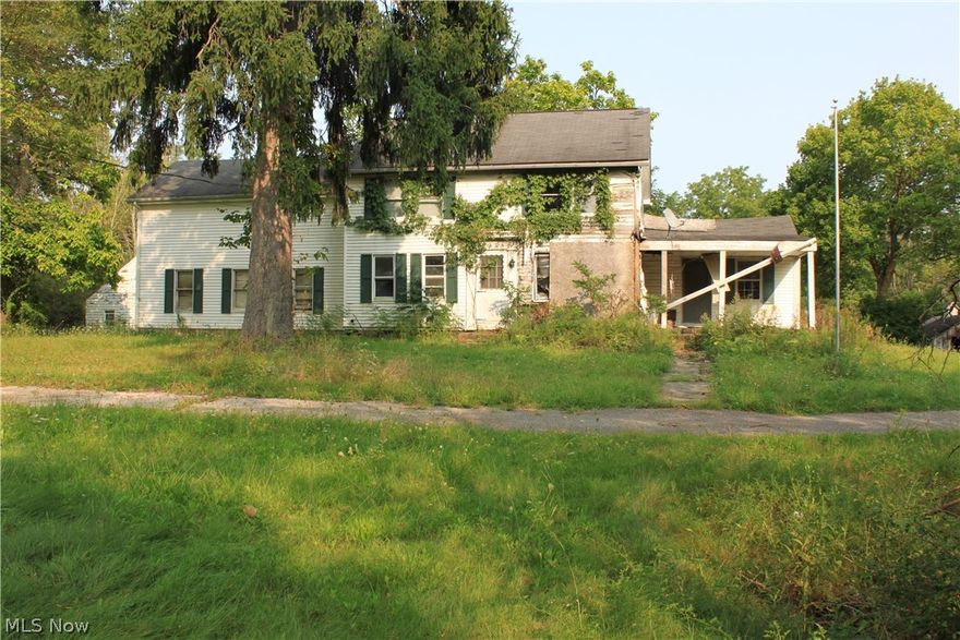 CALLING ALL INVESTORS! Heres a great fixer upper. This home caught fire 8 years ago but is still able to be rebuilt. Home has a large footprint, attached garage, basement and large deck.  This house has so much potential with its 2 acres of beautiful land, and a large detached out building.