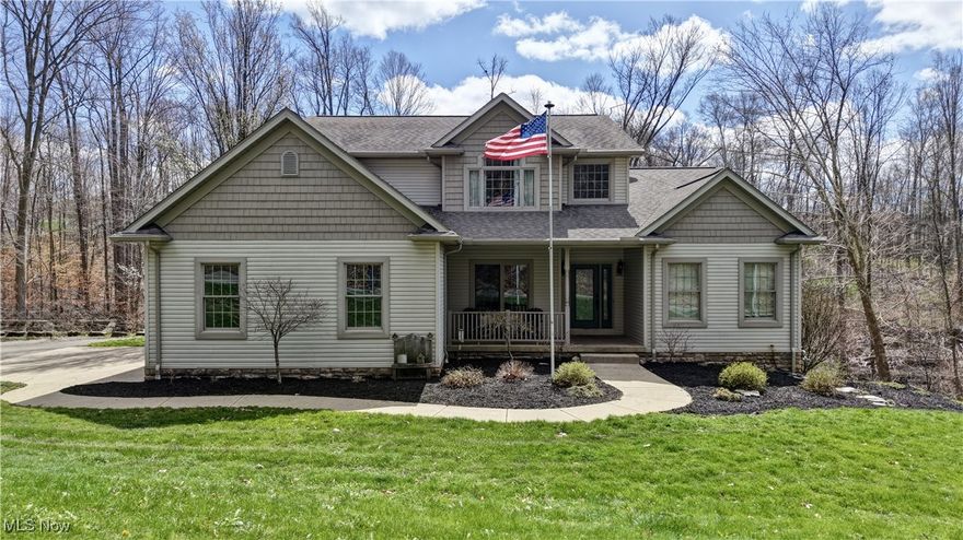 Custom built by Signature Builders in 2005, this 4 bedroom 2.5 bath boasts over 4,000 sq. ft. of living area spread out over 3 levels on 1.5 acres. The first floor features a recent remodel with new fixtures cabinetry, kitchen island, new baths and much more. The layout is conducive to what parties are looking for in modern designs including a first floor master, open living room and kitchen and your own private oasis with an Azek wraparound deck overlooking your year round creek and wooded setting. Located just south of Hiland high school on a township road where privacy is the key. Berlin Township, East Holmes schools, acreage and a custom home, it checks all the boxes.
