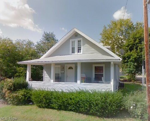 Beautiful three bedroom bungalow with two baths. Home features updated interior with oak cabinets, updated windows, siding, electric, and central air. Not to mention an inviting front porch.