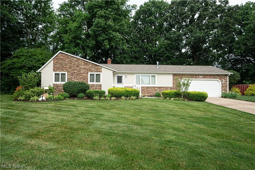 Welcome to this beautiful ranch in a desirable area of Mentor.  You'll enter to an open-concept main living area with beautiful, quality laminate flooring.  The cozy living room has a gas-insert fireplace that warms the room in the winter.  You'll love the built-in shelving that frames the fireplace.  It's perfect for displaying your family pictures and other favorite pieces.  The spacious dining room is separated from the kitchen with a half-wall making it feel open and providing a nice flow.  The kitchen has plenty of counter space and updated appliances.  Down the hall from the living area, you'll find a full bathroom accessible to guests, and 3 large bedrooms including the main bedroom with an ensuite bathroom.  If you like entertaining, you'll love the enclosed porch off the dining room and the patio overlooking a gorgeously landscaped backyard.  The washer and dryer were moved up from the basement to a nook in the garage for the current owner but could be moved back.  The basement has been waterproofed and is partially finished.  You'll be happy to hear that the roof is only about 5 years old.  The furnace and A/C are just over 1 year old.  The hot water tank is also just over 1 year old, so you won't have to worry about the main components for some time.  The seller is also providing a 1 year warranty to give you peace of mind.  Speaking of having peace of mind, this property also comes with a Generac home generator.  You won't have to worry about power outages.  Don't miss your opportunity to own this home at the end of the cul-de-sac.  Call today to schedule a private showing.