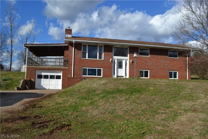 Over 2 acre in a convenient location!! Brick split-level home with hardwood floors and fireplace in the living room, eat-in kitchen, 3 bedrooms and 2.5 baths. The lower level offers plenty of space for family room, rec room, extra bedrooms and a storage area! There is a 1-stall attached garage and a 30x32 detached garage. Enjoy your time on the large covered porch or in the fenced back yard with an above ground swimming pool. Call today for your tour!