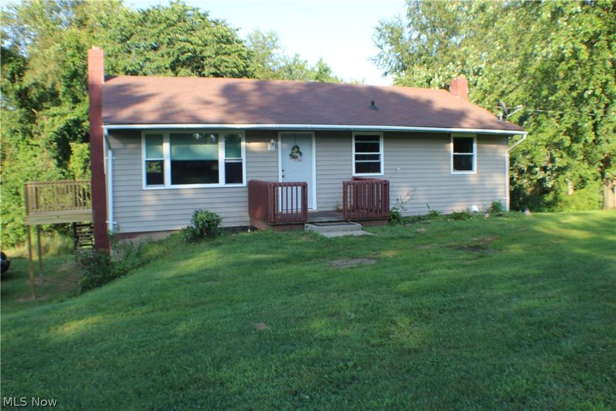 Need a HUGE GARAGE for extra toys?! Then THIS is the house for you!! This charming 3 bedroom, 2 bath Ranch has hardwood floors throughout.  The newly updated kitchen has beautiful knotty pine cabinets! Downstairs also has 2 additional bonus rooms, that can be used as bedrooms, office space or extra storage space! The steel detached garage will blow you away! With room for approximately 6 cars it is perfect for a workshop or storing a camper or boat! Approximately 60 x 40 feet of space with concrete floors! All this on over 1.5 Acres of land! This WON'T LAST LONG! Schedule a showing today!