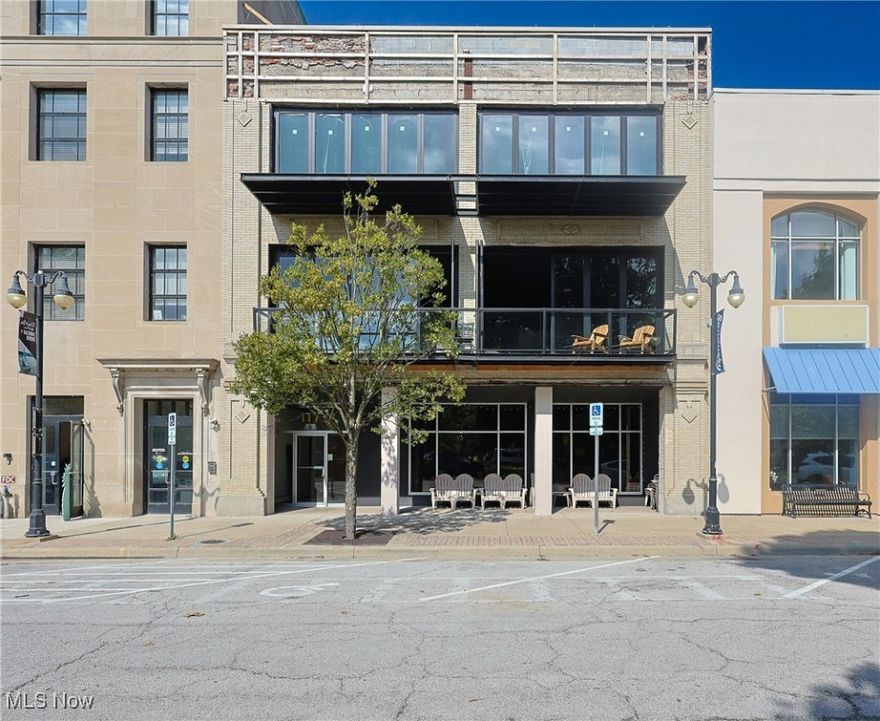 Be one of the first to own a stunning, brand-new condo in the heart of downtown Sandusky, just blocks from Lake Erie. This 2-bedroom, 2-bath home was thoughtfully constructed out of a historic building and showcases soaring 12-foot ceilings, refinished hardwood floors throughout, exposed brick accents, and folding glass doors that open to a balcony overlooking beautiful Sandusky Park. The open-concept living space is filled with natural light and designed for both comfort and style. The kitchen will be installed within 6-8 weeks of an accepted contract, and buyers will have the opportunity to personalize the space by choosing from a curated selection of cabinet and countertop finishes. Additional highlights include in-unit laundry and beautifully finished bathrooms. Offering the perfect combination of historic character and modern elegance, this condo is located across from the park and just steps away from dining, shopping, and the Lake Erie waterfront.