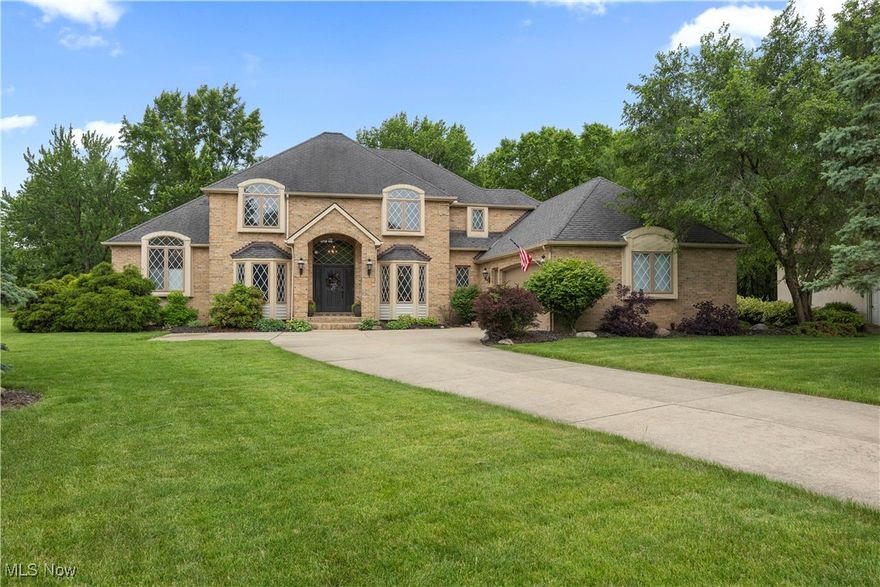 One of a kind custom built home nestled on an exclusive no outlet development consisting of just two culdesacs! A well planned intrerior with extra details throughout! FIRST FLOOR OWNER'S SUITE AND AN ADDITIONAL GUEST/IN-LAW SUITE (on the opposite end of the home from the owners suite)! Perfect for multigenerational housing needs! At arrival, you are greeted with a two story full brick front exterior! Step into a recently refreshed and stylish interior with most all flooring and paint updates since 2021. Two story foyer entry. Spacious home office with full bay window. Formal dining room also has a full bay window. Stunning great room complete with a soaring vaulted ceiling, gas fireplace and double french doors. FIRST FLOOR owners suite with tray ceiling, crown molding. Private full bath with custom ceilings and vanity details, walk in shower and a soaking tub. Dual walk in closets. Cozy lounge with a bar area and custom beamed ceiling.  Beautifully apointed kitchen with a charming dining space! The dining area has built in banquette in the bay window space. Kitchen offers granite tops, island with prep sink, stainless steel appliances, double oven and cooktop! First floor laundry space.  FANTASTIC additional suite on the main level has it's own ADA compliant full bathroom with shower. There's also a walk in closet. Countertop bar sink could be expanded as a kitchenette if you need a mini kitchen space. Remodeled half bath with added wainscoting detail.  Upstairs you'll find three spacious bedrooms, one complete with private full bathroom and the other offers a Jack n Jill bathroom setup!  Full basement with BUILT IN PUTTING GREEN and wall mounted TVs remain. Basement offers great storage and is plumbed for a bathroom. Newer rear deck (2023) and fence (2024), *fence does not extend the entire property.  Nice sized homesite, over half an acre! Furnace replaced 2022.  This home is stunning and cannot be duplicated for the price!