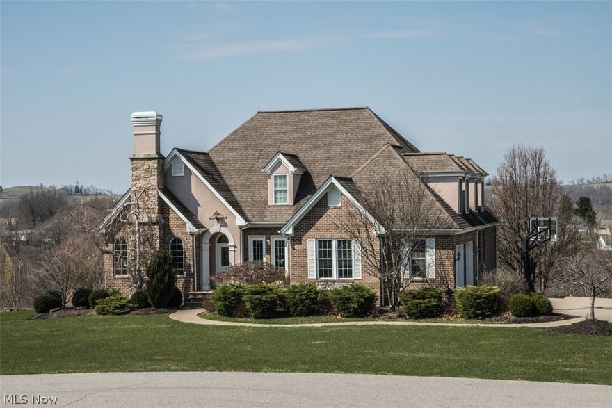 ABSOLUTELY STUNNING!! Outside to inside this ALL BRICK CUSTOM, 5 bedroom, 4.5 bath, 1 1/2 story Cape Cod home with 5 car garage sitting on over 5 GORGEOUS acres is BREATHTAKING!! Let's look outside... Stately & Pristine... paved drive, beautiful landscaping, covered massive rear deck & patio overlooking the fenced in L-shaped IN GROUND POOL with SLIDE, fire pit, and two car detached garage. Let's peek inside...OVER 3100 SF of CUSTOM CLASS!! Hardwood flooring, crown molding, built-in's and neutral color themes pour throughout! The eat-in kitchen w/eat-at bar, tons of beautiful cabinetry and hard surface counters, cathedral ceilings in the open concept Great Room (w/fireplace), separate formal dining room, cozy library/study (with fireplace), first floor laundry, massive windows with loads of natural lighting, to the AMAZING DUAL MASTER SUITES on each end of the home allowing for complete privacy! ALL bedrooms and bathrooms are SPACIOUS, well lit and COMFY!! Let's look at the lower level... a HUGE WALK OUT REC ROOM with lots of viewing windows to the patio and pool! PLUS...a work out room, a bathroom and when it's time for business, an awesome home office! LIVING THE ELITE LIFE! Seller to convey mineral rights. Property is currently under lease. This home will be in high demand. Call today!