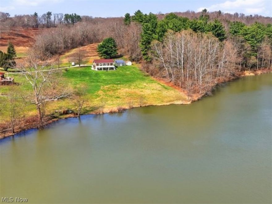 Welcome to 1430 Magnolia Rd — a stunning, fully renovated lakefront retreat on Atwood Lake, set on a private 1.4-acre wooded setting that feels like a year-round resort. Thoughtfully redesigned from top to bottom within the past five years, this home offers peace of mind, quality craftsmanship, and effortless lake living.

Wake up to breathtaking water views, sip your morning coffee on the expansive 43-foot balcony, and unwind in the evenings on the covered 39x16 concrete patio surrounded by nature. Multiple outdoor living areas, fresh concrete walkways, gated stairs, and beautifully refreshed grounds create a seamless indoor-outdoor lifestyle ideal for entertaining or quiet relaxation.

Inside, the home has been completely rebuilt with all-new electrical, plumbing, insulation, drywall, framing, luxurious hardwood flooring, and custom built-ins. The open kitchen features Corian countertops and flows effortlessly into inviting living spaces highlighted by electric fireplaces and panoramic lake views. With three bedrooms and 2.5 baths, the layout offers both comfort and flexibility for full-time living or a weekend escape.

Major systems and infrastructure have also been comprehensively upgraded, including the septic system, well equipment, and water treatment, providing confidence and long-term value. The sellers spared no expense, designing this home with the intention of staying forever — and it shows in every detail.

Surrounded by mature woods and overlooking Atwood Lake, this private setting offers kayaking, fishing, and serene waterfront living just steps from your door. A rare opportunity to own a beautifully updated lakefront home where nature, luxury, and lifestyle come together.

See supplements for a complete list of renovations and improvements. PRIVATE LAND. NO lease/HOA or MWCD fee.