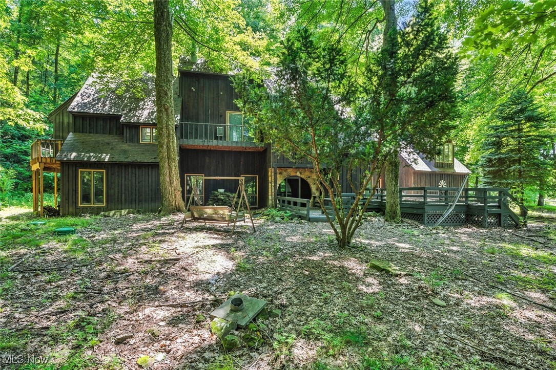 Custom built one of a kind home is certain to impress. 2.32 wooded acres providing spectacular views all year round. Open layout compliments today's living. Totally remodeled kitchen is a chef's dream offering gorgeous granite countertops, mahogany colored cabinetry, stone backsplash and stainless steel appliances... opens to spacious dining area. High vaulted ceilings and loads of unique features throughout. 4 bedrooms and 3 full baths. Private office. Large primary suite includes additional living room, full bath, skylights and private deck. The large second floor bedroom could also be an in-law suite, exercise or hobby room with screened in porch attached. Property is outstanding offering trails, outbuildings and more. Great location close to highway and the beautiful town of Vermilion. You've found your privacy... call agent today.