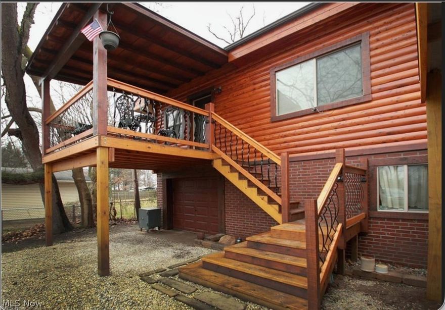 Beautiful raised ranch you truly have to see to appreciate. Pictures just don’t capture the craftsmanship and character of this home. The rustic exterior features Eastern Red Cedar logs, while the covered deck showcases wrought iron railings accented by substantial Douglas Fir posts, creating a warm and inviting first impression.

Step inside to neutral paint tones and distinctive rough-cut trim around windows and baseboards that carry the rustic charm throughout. The kitchen continues the theme with custom rough-cut oak cabinetry and countertops, along with a unique cedar log bar top. Appliances include a stove and microwave (2017), dishwasher, and smart refrigerator (2025).

The main level offers a spacious living room, three bedrooms, and one full bathroom. The lower level includes an additional bedroom, full bathroom, a large family room that is perfect for everyone to spread out, plus a storage room and a dedicated laundry room.

Situated on a fenced lot near Long Lake, the property also features a deep garage that can accommodate two cars tandem, a two-car carport, and a 12x12 outbuilding with a 2" thick floor and 7' sliding doors.

Recent updates include Low-E double pane windows, glass block windows (2017), tankless hot water tank (2018), medical-grade furnace with UV filter (2021), updated ductwork (2017), PEX plumbing (2016), electrical (2015), new well pump and new water lines to the house, new water filtration system, new water softener, and new reverse osmosis system. Additional updates include new downspouts, new ceiling fans in bedrooms and kitchen, new toilets with a bidet in the upstairs bathroom, and storage shelves in the storage room that will stay.

Washer and dryer (2017) stay, along with a new pool pump (2022/2023) and the new 2025 pool sun cover.