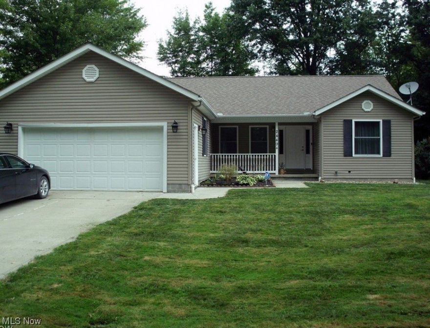 Gorgeous ranch home on 3/4 of an acre in Roaming Shores!  Yes you read this right!  Very unique property with the benefits of lake living and the joy of country living!  Wow the best of both worlds with 1/2 acre in Morgan twp!  This is an immaculate home, the pride of ownership is apparent the moment you walk in the door.  This 3 be, 2 bath split plan is like a brand new home.  Hardwood floors throughout the the living room and master bedroom.  Ceramic tile in the kitchen and baths.  Patio sliding door of the living room to back yard deck with gorgeous view.  Wood burning fireplace in the living room for those cozy nights.  Dont miss this one.