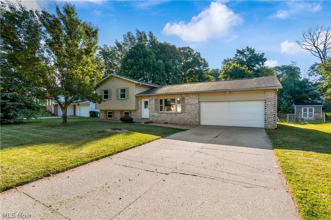 Adorable split level in Northwest LSD! 3 bedrooms, 2 full bathrooms, and plenty of living space! Both bathrooms have been beautifully renovated, along with fresh paint throughout the home, new flooring, and brand new carpet (June 2021) The kitchen has brand new custom cabinetry, shiplap accents, with stunning quartz countertops, all updated in 2021! The main floor offers a spacious living room and the eat-in kitchen with french doors opening to the generously sized sun room! An additional family room is on the lower level where you can cozy up by the wood burning fireplace! Two car garage plus a fenced in backyard! This home is ready for it's new owners to move right in! H20 Tank (2015)