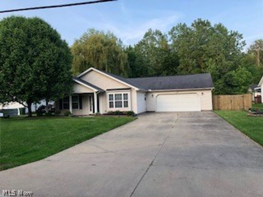 This "Like New" ranch style home is just what you have been looking for. Offering Large open floor plan, vaulted ceilings throughout. Spacious kitchen that leads to open ding room area. Just recently updated with Earthscapes vinyl luxury flooring. Laundry room off the back of kitchen that leads to attached 2.5  car  garage. Heated with storage cabinets and fully finished. Large living room with tons of natural lighting and newer flooring. Three bedrooms and two full baths. Master bedroom with walk-in closet, an exterior door that leads to patio, En-suite with walk-in glamour shower, obscured glass doors and built-in seating. Ceramic tile throughout. All redone within past 2 years. Hall flooring is tile and done within past year. Hot water heat. All new fixtures and ceiling fans new within past 6 months.  Sprinkler system installed but never used. Don't forget the complete fully fenced in yard that completes this house to be a home.