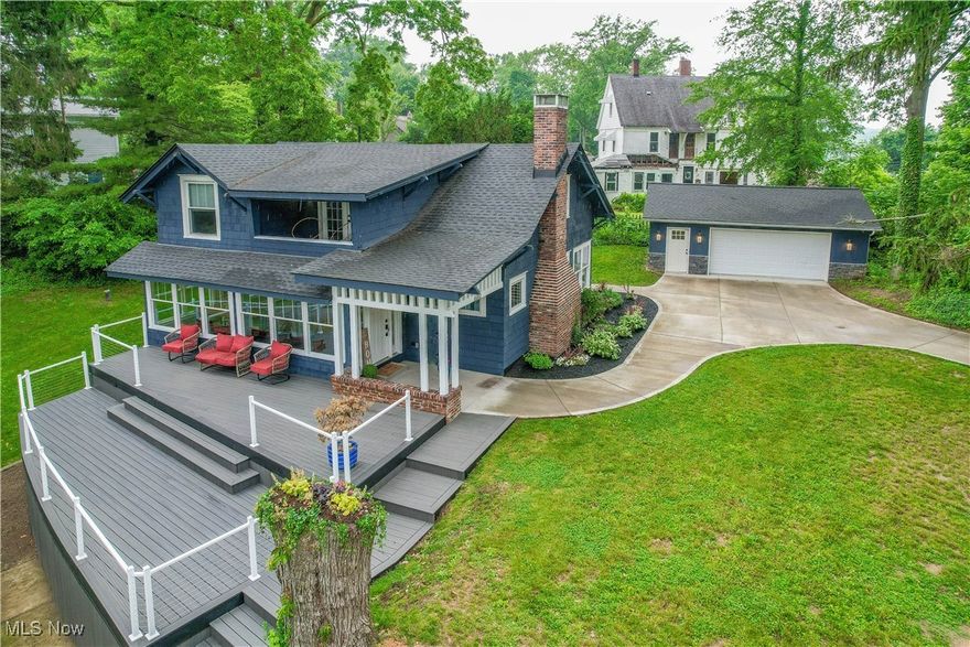 Enjoy lake living in this stunningly remodeled waterfront home! Step inside to the mudroom entry with a charming built-in for your coats and shoes. You'll love the fresh and modern kitchen with granite counters, shiplap walls, and stainless steel appliances. Large windows at the front of the home offer fantastic lake views from both the dining room and the living room with a wood burning fireplace. A convenient laundry and guest bath complete the main level. Upstairs doesn't disappoint with a master suite with en suite bath, two secondary bedrooms that share a remodeled full bath plus a bonus room, perfect for an office with French door access to a covered balcony with a view of the water. Outside amenities include a covered patio and tiered deck for hosting friends and family, a nice yard for outdoor games and a dock for your boat. A new 2 car garage and concrete driveway add plenty of space for parking. In addition to the house being remodeled down to the studs, this home also has a newer roof, windows, well, septic, concrete and garage. Don't miss this Portage Lakes beauty!