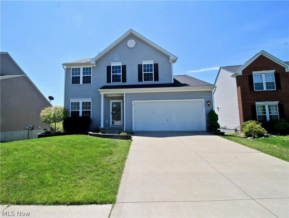 Beautifully updated and ready for it's new owners. This three bedroom, two and a half bath Colonial home features gorgeous bamboo flooring in the family and living room, and ceramic flooring in both kitchen and bathrooms. Large open floor plan with white washed pallet wall in the family room. Upgraded maple cabinets with plenty of storage, the center island provides extra work space and storage as well. Sliders off the dining room take you out to the back 10x18 deck completed in 2017, where you can enjoy your large fenced in yard. Upstairs provides three large sized bedrooms with a loft. Master suite with garden tub and walk in shower, and a large walk in closet. Spacious walk out finished basement with a cherry bar top and cement counter top. Centrally located on a cul de sac in a quiet kid friendly neighborhood with updated lighting, and window treatments, as well as complete landscaping with mulched bushes. Garage has water and drain w/ above head storage, also wired for security.