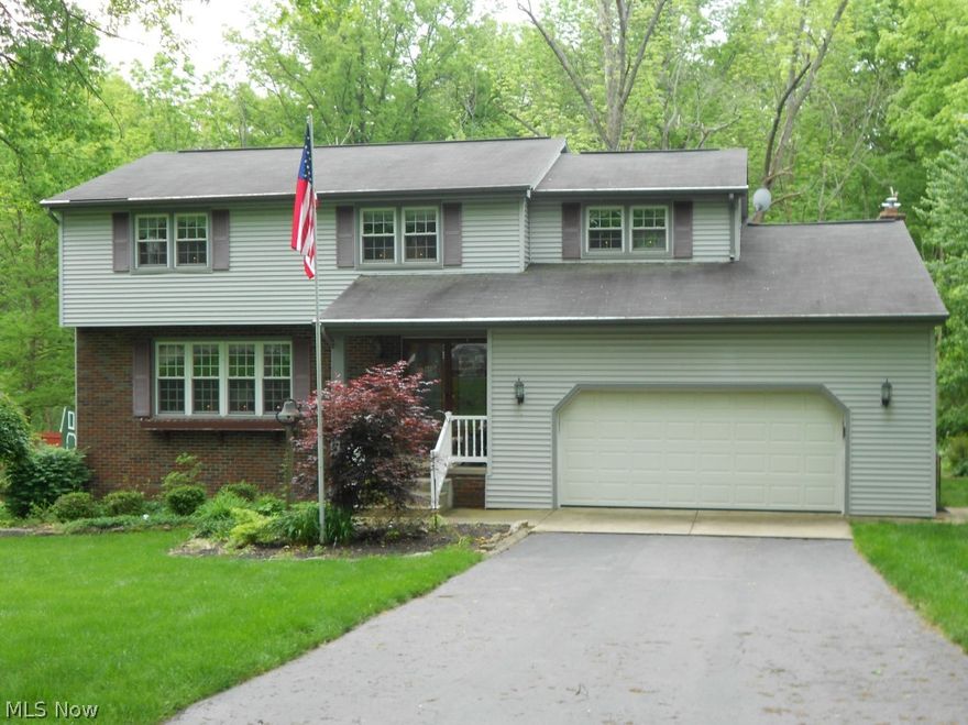 Touch of class! Lovely home on wooded lot in quiet neighborhood. Newer kitchen with black granite countertops and stainless steel appliances. Family room off kitchen with gas fireplace and 1/2 bath.  Beautiful foyer with oak and slate/tile. Oversized garage. Nine closets on second floor. Florida room overlooking three patios. One patio has firepit. Basement has family room, separate double doors to patios, nice tool room, large laundry room with 4 closets and lots of space for crafting/sewing/working from home.
