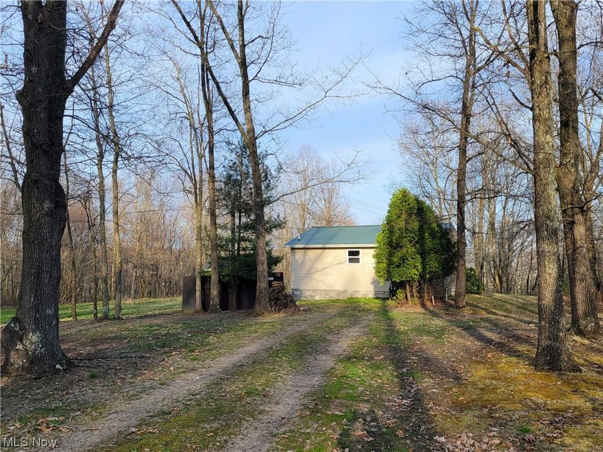 This cabin sits close to town with seclusion and a tranquil feel. Set as a studio style cabin, it is ideal for an AirBNB or a permanant camp. With Brush Creek Wildlife Area and Highlandtown Wildlife Area nearby it give the perfect opportunity to have a camp close to hunting. The 10x10 shed is included in the sale and offers the ideal place to store equipment and toys. More acreage in close proximity. 

Parcel 72-01663.000 must close and transfer before seller close on this property. All offers will be contingent on this per the seller request.