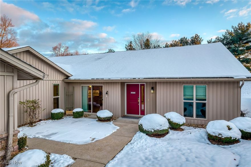 Welcome to this beautifully updated North Ridgeville retreat that blends modern style with thoughtful design in an unbeatable location. Although originally constructed in 1995, this home wasn’t completed until 2016 and has had just one meticulous owner ever since. Inside, you’re greeted by a bright, open layout anchored by a stunning great room with vaulted ceilings, a gas fireplace, and dramatic floor-to-ceiling windows fitted with custom blinds. The seamlessly connected dining area leads into the true showstopper of the home, a sprawling, modern kitchen featuring sleek cabinetry, granite countertops, an island snack bar, and stainless appliances. Even the storage has personality: a former oversized closet has been transformed into a one-of-a-kind wine bar, while another conveniently serves as a dedicated kitchen pantry. Off the dining room, a charming bonus room makes the perfect office, den, or creative space. The spacious primary suite continues the airy feel with its vaulted ceiling, private bath, and generous walk-in dressing room, complemented by two additional bedrooms and updated bath. Thoughtful upgrades throughout include modern doors, refreshed interior components. Outside, the oversized two-car garage adds practicality with a floor drain, cold water access, and a service door, while the private patio and professionally landscaped courtyard create a peaceful place to unwind. Situated on a quiet cul-de-sac with access to walking trails leading to the community clubhouse, fitness center, Olympic-sized pool, and play area, this home also offers unmatched convenience — just minutes from shopping, dining, and quick freeway and turnpike access. With its welcoming layout, stylish updates, and ideal location, 8573 Woodbridge delivers a rare combination of comfort, charm, and everyday ease.