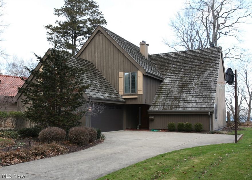 Warm and inviting Bay Village lakefront with gorgeous year round lake views! This home was built in 1972 and has been updated to fit the modern lifestyle. The views from the master suite are breathtaking and offers its own sitting area and fireplace. The living room has a vaulted ceiling, a fireplace and newer carpeting. The family room has a fireplace and doors that open to a patio which is perfect for entertaining. The main house is cedar sided with a newer shake shingle roof. The high-end kitchen boasts granite, newer appliances and more! Additional updates include newer hot water tank and flooring. This fantastic property offers stunning views of the city, has true lake access with breakwall and its own beach house! The large beach area allows for swimming, fishing and boating. Call today for your private tour!