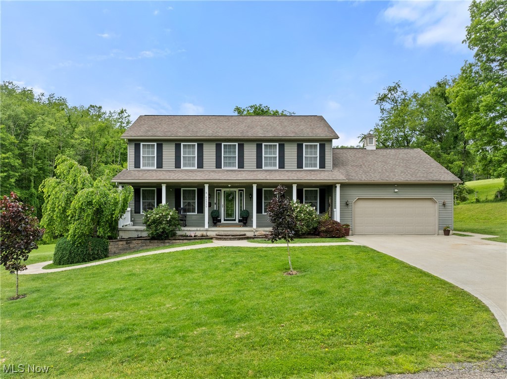 WOW!!! Are you looking for your DREAM HOME?! This is sure to be the one! Welcome to 66950 S Ray Road. Pulling into the driveway you will already fall in love with the private, quiet location 5 minutes from town (OUTSIDE of St. C Taxes) & the beautiful landscaped and maintained home. Step inside to a floor plan perfect for the whole family. The main floor features an open eat in kitchen that flows into the living room area with beautiful stone accents that accentuate the gorgeous stone fireplace making the living room feel warm and inviting all year round. The kitchen has plenty of room for dining at your table or large kitchen island & if that is still not enough space you can also entertain in the large formal dining room. Also, on the main floor is a full bathroom & bonus room that can be used as a play space for the kids, home office, or additional living space. Upstairs features FOUR bedrooms and two full bathrooms; one of which is your expansive master suite! Downstairs in the finished basement is a fifth bedroom, bonus room, and full bath. Did I mention STORAGE?! There is endless storage space that could also be more finished square footage. The possibilities are endless!
Outside the true beauty continues. A large covered deck off the back of the home overlooks the gorgeous property and your BRAND NEW (installed in June) swimming pool!! Talk about maintenance free! Just kick back & enjoy this summer. The best part of the property lies behind the doors of the large barn... Inside features a state of the art man cave that you just have to see to believe. All of this on ~2.5 acres with NO DEED RESTRICTIONS! Homestead dreamers WELCOME to your dream oasis! Check out the highlight sheet there are to many amazing features to even fit in this description! Schedule your showing to see all this home has to offer!