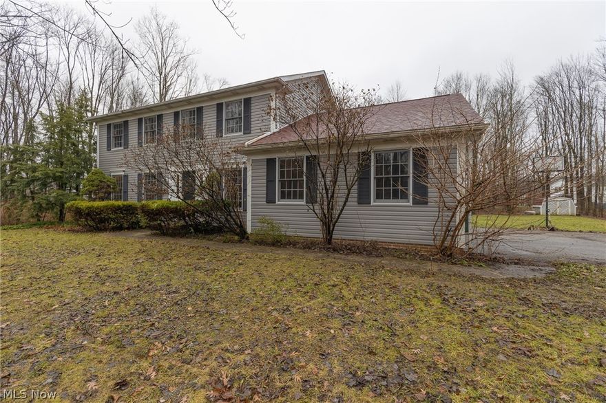 Welcome to this gorgeous 4 bedroom 2.5 bathroom colonial nestled on a stunning 1.7 acre wooded lot. This light-filled home is set far back from the street and offers the park like setting that you have been waiting for! The large eat-in kitchen features custom wood cabinetry, newer appliances, gas range, and a wide open floor plan to the family room complete with a beautiful wood burning fireplace and hardwood floors. The dining room features wood flooring, crown molding and chair rail. The living room has brand new Pergo flooring and French doors, perfect for use as a first floor office. Off the family room step outside to the breathtaking backyard, complete with a deck, patio, partially fenced in area and gorgeous mature trees. The second floor offers 3 bedrooms and an owner’s suite with attached full bathroom and large walk in closet. One of the best features of the home is the completely finished lower rec that boasts an amazing all stone remote control gas fireplace, perfect for e