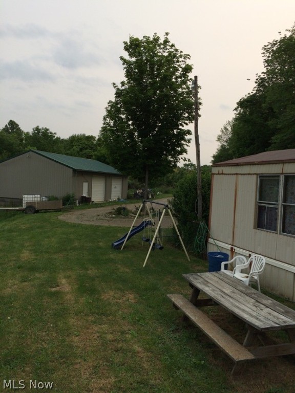Build your Dream Home on this Beautiful Country setting, 4.95 acres in Franklin Local Schools with a 30x40x10 Pole Barn Building with concrete floor and electric. There is also a 1989 Three Bedroom Two bath Manufactured home , Property needs TLC and cleaned out was previously used as a rental property.