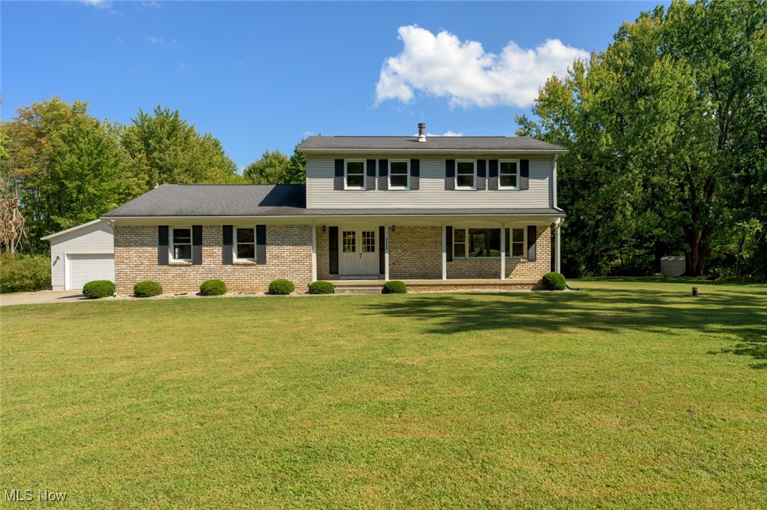 Expansive Traditional Colonial on a Scenic Park-Like 3 Acres
Welcome to this stunning, classic two-story colonial that exudes timeless elegance and offers an abundance of space for comfortable living. Nestled on over 3 acres, this home features a massive front porch perfect for relaxing or entertaining, double entry doors, and a long concrete driveway leading to an attached two-car garage and detached outbuilding.
Step inside to discover a formal living room and dining room bathed in natural light from large windows. The spacious kitchen with a center island flows seamlessly into an oversized family room - complete with a brick fireplace, making it the perfect gathering space. A charming sunroom with original wood beams adds character and warmth, creating a serene retreat.
This home offers four bedrooms and three full baths, one of these on the main floor, including a primary suite with dual closets and an en suite bath. Enjoy the convenience of two separate laundry areas—one on the first floor and one on the lower level. The basement offers endless possibilities.
Additional features include an oversized detached garage/outbuilding ideal for hobbies, storage, or a workshop, as well as a separate storage shed.
With its combination of expansive indoor and outdoor space, classic charm, and a peaceful park-like setting, this home presents endless possibilities and potential for the perfect family retreat.