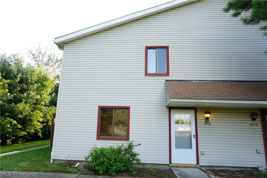 Welcome to this fully updated two bedroom, one and a half bath condo!  The entire unit has been freshly painted, laminate wood-grain flooring throughout the first floor and new carpeting on the stairs and bedrooms on second level.  Full bath with new vanity is also found on the second level.  The master bedroom hosts two large walk-in closets!  New interior doors and hardware throughout with new exterior door and hardware!  Brand new stove can be found in the bright, white eat-in kitchen along with a newer microwave and refrigerator.  All kitchen appliances stay!  Off the kitchen is a private patio that overlooks greenery and large field.  Unit also comes with a private 1 car garage.  Schedule your showing today.  This quaint, end unit will not last long!