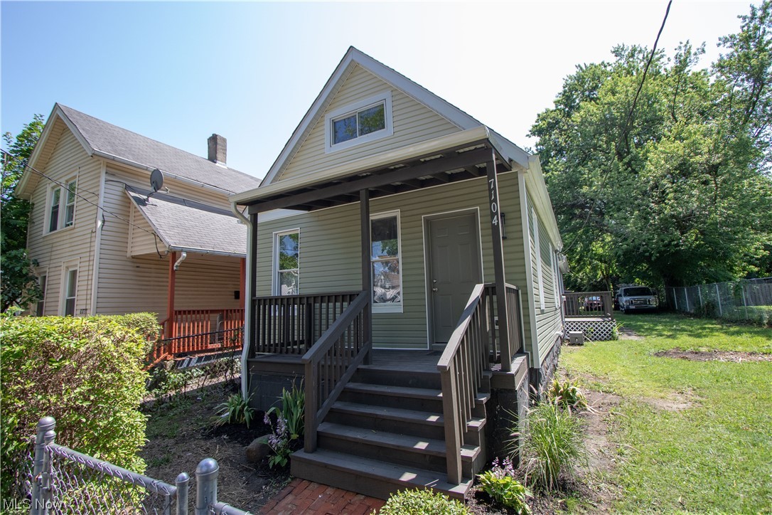 Charming Cape Cod with inviting front porch. The main floor has natural lighting, a full bathroom, two bedrooms, and a beautifully remodeled kitchen with all new appliances. The second floor features a third bedroom with a half bathroom. Easy to maintain yard, fully fenced backyard with plenty of shade. Located minutes from Opportunity Corridor and on a street with a lot of newer homes. All new in 2022: roof, electric, plumbing, paint, interior and exterior doors, bathrooms, tankless hwt, furnace, AC, siding, and all the kitchen appliances.