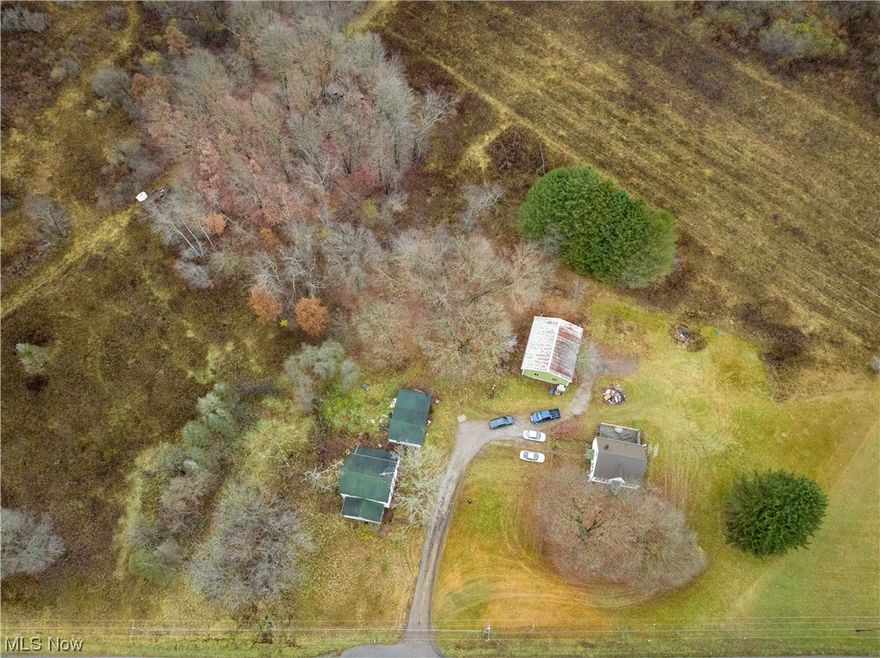 Two homes on separate lots. Totaling 1.95 acres, this conveniently located package deal could make a wonderful income producing property, or the owner could live in one house as they flip the other. Tons of possibilities. Cash Only. 7366 will need to be fully gutted. UPDATES: Updated electric hot water tank. Updated well components. Interior photos are of 7394, which is currently occupied. Updates to 7394 are Metal Roof on house- 2023, Basement dry-lock- 2023 , Hot Water Tank- 2023, Electric Box- Updated.