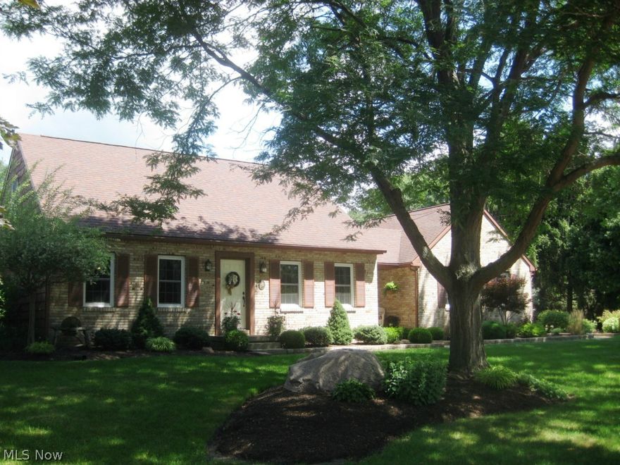 Custom built, top quality 1.5 story. First floor master being used presently as dining room. Inviting open floor plan. 4 season sun room with cathedral ceiling and French doors leading to private 0.43 acre fenced backyard. Lush landscape and English garden. Finished lower level with workshop, storage and shower. Delightful!!