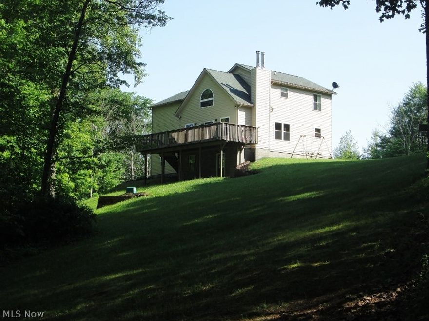 Tranquility...one of the best words to describe this 3-4 bedroom, 2.5 bath home situated in the middle of 9 beautiful acres. Your family will love it. Every view from the home overlooks the nicely mowed grounds and the wooded grounds on this hard to find private setting. This well built 2003 home features 2x6 exterior walls and is well insulated providing reasonable utility costs. The main floor features a great room with towering walls & vaulted ceilings that is open to the dining room & large oak kitchen with eat at bar. Kitchen appliances remain. Easy to maintain ceramic tile is featured through this area. Off the great room is a magnificent composite deck that overlooks the woods with plenty of opportunity to enjoy the outdoors as well as the wildlife that graces the grounds. 1/2 bath on main level. Solid oaks steps lead to the upper floor featuring an open loft overlooking the great room below. In addition on this level is the master suite with a private master bath with a double