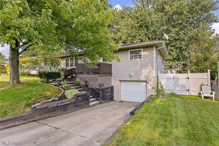 This adorable and well-maintained 3BD/1.5BA raised ranch home is in the heart of Ellet, but conveniently located near the Tallmadge border Routes 91 and 76, and Goodyear Metro Park. Recently updated, this open concept home has newer wood-look laminate flooring throughout the living room, dining room, and kitchen (2020) and an updated kitchen with painted cabinets and stainless-steel appliances (Fridge replaced in 2015). Rooms and trim have been painted soothing neutral colors and all bedrooms have natural hardwood floors. Full bath on main level includes a jetted tub and has newer lighting and hardware (2021). Downstairs enjoy extra living space with a finished family room and convenient adjacent half bath and large laundry area with a separate shower. An attached 1-car garage provides extra storage and ease of entry from the exterior. From the dining room enjoy the outdoors through a sliding door that opens to a large deck overlooking the private and fenced rear yard and storage shed