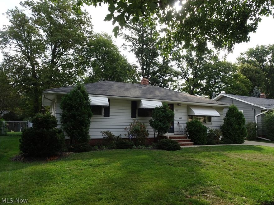 Ever want to go back to a simpler, easier time? Well, we can't do that, but this amazing 3 bed 1.5 bath Ranch can help set the scene. Fresh concrete, detached side load garage, fenced yard with a deck; that's just the outside! Open floor plan kitchen (all appliances), dining room w/wainscoting, french doors to the deck, hardwood flooring throughout, full bath with jetted tub (and a bath 1/2) plus a classic "Parma Kitchen" IN THE BASEMENT - picture the set of "Mad Men". Meet Don Draper at the wet bar for a quick one and then it's off to the boardroom to hammer out your offer! SPECIAL BONUS: full workbench, newer HVAC and a cedar closet/humidor in waiting! A MUST SEE!!
