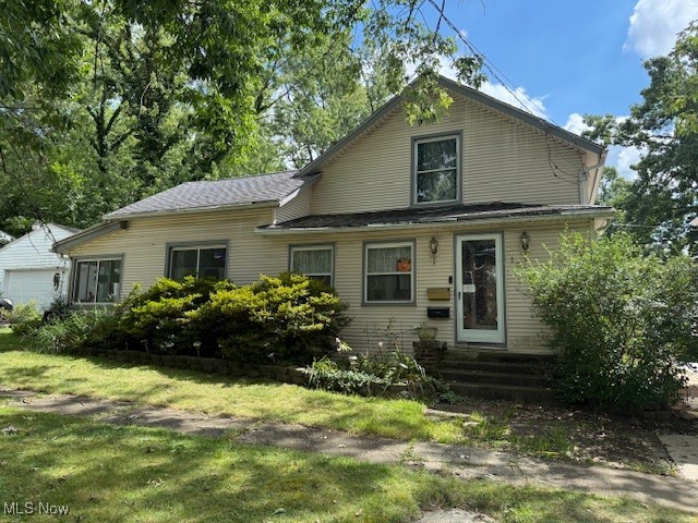 Welcome to 146 W. Elm St. in beautiful Kent Ohio. This home is located near many city life features including historic downtown Kent and Kent State University. This home is a 3 bedroom, one full bath, with 1627 sq. ft of living space. This is an older home with beautiful woodwork throughout the house. There is a large renovated kitchen that was completely remodeled a few years ago. The kitchen has a ton of cabinets, and counter top space for all your cooking and baking needs. The living room and family room are of good size with a ton of natural light. You will find the master bedroom on the first floor as well with access directly to the first floor bathroom that has also been remodeled in the last few years. The dining room is currently being used as a craft room that also has laundry hook ups. There are an additional two large bedrooms upstairs and an additional room that could be used as an office, or additional storage space. There is a full unfinished basement that has a newer furnace which was installed in 2021 and the basement was waterproofed in 1999 with a transferable warranty. Outside there is a nice breezeway, and a large detached 2 car garage. Come take a look and schedule your private showing today.