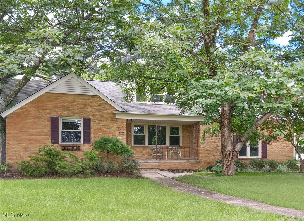 Welcome to this exquisite 3 bedroom, 2 full bath brick bungalow nestled in a serene neighborhood. As you approach, admire the lush, tree-filled backyard featuring a two-tiered deck and bespoke bluestone patio built in 2018, perfect for entertaining or simply unwinding outdoors. Step inside through the sliding doors and be greeted by stunning hardwood floors that flow throughout the main level. The large eat-in kitchen has been tastefully updated with stainless steel appliances and granite countertops, making meal preparation a joy. The first floor bath, remodeled in 2024, offers a walk-in shower, new flooring, vanity, and toilet. There are convenient washer/dryer hookups discreetly installed in the south bedroom closet. Upstairs, the primary suite awaits, boasting dreamy hardwood flooring and an enormous newly remodeled full bath. This spa-like retreat features TWO walk-in closets, a double vanity sink, a luxurious walk-in shower with glass doors, and updated flooring, ensuring both comfort and style. The finished basement boasts a cedar closet and is a versatile space with newer LVP flooring and fresh paint, ideal for a recreation room, home office, or gym. Additional updates abound, including a newer roof (2023, full tear off), furnace (2023), attic insulation (2024), and chimney rebuild (2023), and newer hot water tank, ensuring peace of mind and energy efficiency for years to come. The two-car attached garage makes coming and going simple and easy. Don’t miss the opportunity to make this meticulously maintained home yours. Schedule your showing today and discover the perfect blend of modern amenities and classic charm in this inviting bungalow.